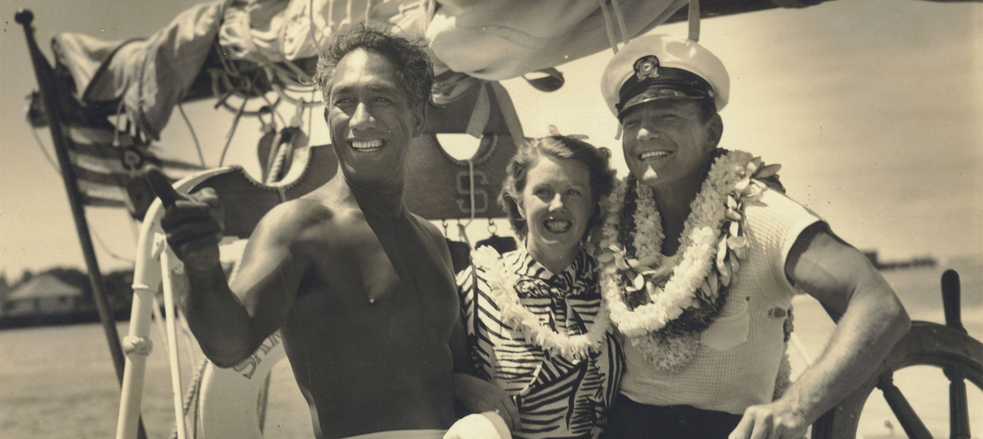 Duke on boat with happy couple